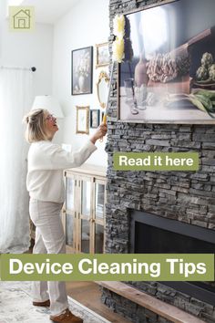 a woman cleaning a fireplace with a brush