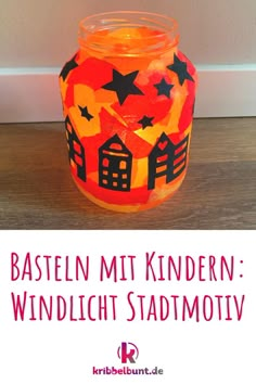 an orange glass jar with black stars on it and the words basteln mit kindern