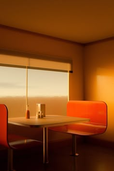 two orange chairs sitting at a table in front of a window