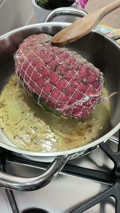 a steak is cooking in a pan on the stove