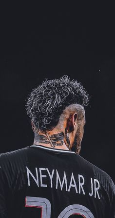 the back of a man's head with tattoos on his face and neck, wearing a jersey that says neymar jr