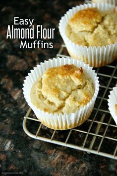 three muffins sitting on top of a cooling rack