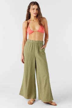 Cute and lightweight pull-on pant that has a solid color design and comfort elastic waist. O'Neill Women's woven pant Flowy leg Elastic waistband Solid color wash 100% Cotton Crinkle Double Gauze Green Pull-on Pants For Loungewear, Relaxed Summer Bottoms With Pull-on Style, Straight Leg Bottoms With Pockets For Beach, Beach Bottoms With Pockets And Straight Leg, Wide Leg Parachute Pants With Pockets For Vacation, Green Casual Pull-on Bottoms, Wide Leg Cotton Cargo Pants For Vacation, Casual Khaki Beach Bottoms, Wide-leg Cargo Pants With Pockets For Vacation