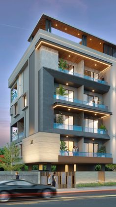 an apartment building with balconies on the second floor and balconies on the third floor