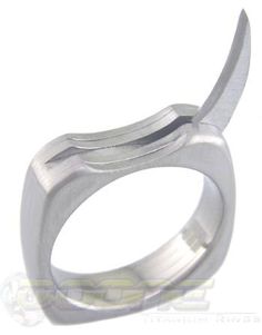 Raptor is a titanium ring with a single retractable blade that pivots out. It gets its name from the curved slashing claw of the Velociraptor. The stainless steel blade can be used to open boxes or cut packing tape or can be used as a last line of defense. The ring is custom made in exactly your size. The width remains at 6.3mm. The Brushed finish seems to work best, so I left off those options. The inside of the ring gets a polished finish for comfort. Although the ring can be engraved, the int Roman Fonts, Titanium Ring, Packing Tape, Latest Gadgets, Titanium Rings, Gold Coins, Engraved Rings, Silver Bracelet, Custom Made