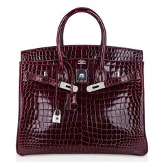 exceptional Hermes Birkin 35 Diamond Porosus Crocodile bag featured in jewel toned Bordeaux.Exquisite and rare color, this Hermes Birkin bag with 18K White Gold hardware is set with 10.23 diamonds.Hermes diamonds are ethically sourced.Comes lock and keys in the clochette, sleeper and rain protector.Plastic on hardware. Carried one time.Mightychic shares your passion for exquisite and whimsical Hermes creations and provides you access to that one single item, or to build a superior collection with discreet personal service. final sale BAG MEASURES:LENGTH 35 cm / 14" TALL 25 cm / 10"DEEP 18 cm / 7" HANDLES:TALL 5"CONDITION: Very Like New Will be delivered with Box, dust bag, card, booklet and receipt Exchange Accepted in this cases :/p> Hermes Birkin Bag, Hermes Birkin 35, Crocodile Bags, Looks Party, Jane Birkin, Hermes Bags, Hermes Bag, Hermes Birkin, White Bag