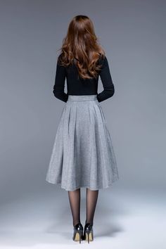 "A short wool skirt for autumn, winter. A simple work skirt. DETAIL * 30% wool, 30% fiber, 40% polyester * fully satiny lining, more nice to the touch body * Seam pocket * Right zipper closure * Below knee length * Wash by hand or machine with cold water SIZE GUIDE Size vary between Brand and Country Please get your body measurement with our Size Guide And Find your size in our Size Chart Size Guide https://www.etsy.com/listing/722950722 SIZE CHART https://www.etsy.com/listing/736810337 This Vid Chic Winter A-line Pleated Skirt, Formal Flared Skirt For Fall, Flared Skirt For Formal Fall Occasions, Chic Flowy Wool Skirt, Elegant A-line Fall Skirt, Elegant Knee-length Skirt For Fall, Elegant Wool Pleated Skirt With Lining, Chic A-line Wool Skirt, Chic Wool Flared Skirt