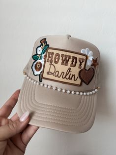 This custom made trucker patch hat is perfect for any occasion whether it be for spring/summer time, a lake hat, a gift for someone, or just a cute accessory to add a little spice to your outfit 🧢✨ DETAILS-  * This hat is one size with an adjustable SnapBack that is adjustable from 20in. - 23.5in. * The color of this hat is Tan * The material of the hat is polyester with iron on patches  REFUNDS AND CANCELLATIONS- Every hat is handmade by me as a result, a slight variation can occur from the picture with patch size or placement. If you have any problems with your hat please message me within 24 hours of receiving your order and I'd be happy to help! No refunds or exchanges will be accepted after. CONNECT- To enter giveaways, discount codes, or behind the scenes, follow our pages. 📲 Insta Cheap Trucker Hat With Letter Patch, Trucker Patch Hat Ideas, Spring Trucker Hat, One Size Fits Most, Spring Trucker Hat With Flat Brim, Adjustable Trucker Hat For Spring, Brown Snapback Trucker Hat For Spring, Beige Trucker Hat With Flat Brim, Brown Flat Brim Trucker Hat For Spring, Beige Flat Brim Trucker Hat