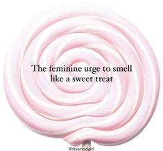 a pink lollipop with the words, the feminine urge to smell like a sweet treat