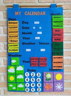 a bulletin board is hanging on a brick wall with calendars and weather dates for each month