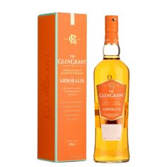 a bottle of whisky sitting next to an orange box