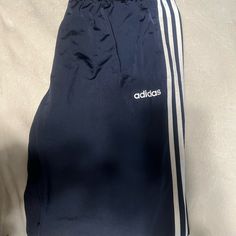 New With Tags Men’s Adidas Drawstring Jogging Pants. Navy Blue With The 3 Classic Adidas Strips Down The Legs In White. Size Xlt. These Are Straight Legged, Not With The Cuffed Elastic Ankle. Blue Joggers With Three Stripes For Jogging, Casual Blue Joggers With Three Stripes, Casual Navy Adidas Bottoms, Casual Navy Adidas Pants, Adidas Long Pants For Loungewear, Casual Navy Pants With Three Stripes, Blue Athleisure Bottoms With Three Stripes, Blue Athleisure Pants With Three Stripes Branding, Stretch Blue Bottoms With Three Stripes