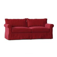 a red couch sitting on top of a white floor