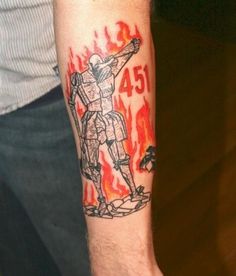 a man with a tattoo on his arm that has a drawing of a person holding a fire extinguisher