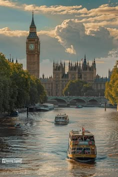 the big ben clock tower towering over the city of london as boats travel down the river