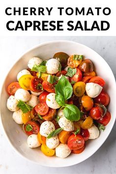 a white bowl filled with cherry tomato caprese salad