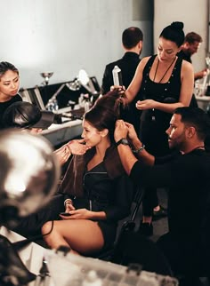 a group of people getting their hair done