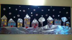 an art project made out of duct tape with houses and snowflakes on it