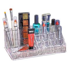 a clear acrylic makeup holder with various cosmetics and nail polishes