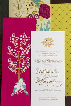 the wedding stationery is laid out on top of each other