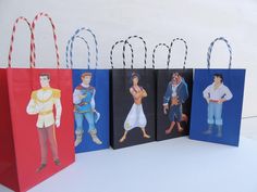 four paper bags with the characters of disney's princess and prince are lined up against a white background