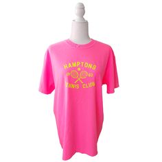 Serve up some serious style with the Hamptons Tennis Club T-Shirt! This preppy tee is the perfect way to add a pop of color to your to your summer wardrobe. Comfortable and stylish, it's perfect for the beach, pool or simply enjoying a warm day. But it's not just about style - this neon pink t-shirt, made by comfort colors is made with comfort in mind. Get ready to be the trendsetter this summer (and don't forget to size up for a trendy oversized fit!) Fabric: 100% Cotton Design: Neon Yellow hea Summer Sports T-shirt With Screen Print, Sporty Pink T-shirt With Screen Print, Short Sleeve Summer Tennis Tops, Summer Short Sleeve Tennis Tops, Summer Tennis Tops With Short Sleeves, Short Sleeve Tennis Tops For Summer, Spring Tennis Tops With Graphic Print, Spring Crew Neck Tennis Tops, Spring Tennis Crew Neck Top