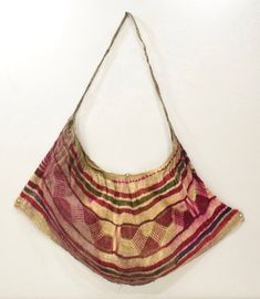 This is a unique Red and Beige Bilum Bag from the West Sepik Province, Papua New Guinea. Throughout New Guinea and West Papua string bags are essential companions to men, women, and children, protection, and fertility. The flexible, looped net bags called Bilums are made by women, using hand-spun bark fibers formed into a strong two-ply string. In the many regions, men and women have separate roles in relation to the production and use of the string bag. Women hand-spin bark fibers and loop expa Bilum Bag, West Papua, Net Bag, String Bag, Overland Park, Market Tote, New Guinea, Hand Spinning, Papua New Guinea