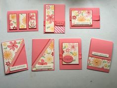 some cards and envelopes are arranged on a table