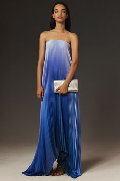 The perfect balance of drama and simplicity, the L'IDÉE Elle Gown offers a simple maxi silhouette with pleated crepe fabric, a straight neckline, and an asymmetrical hem for understated elegance. | Elle Strapless Pleated Gown by L'IDÉE in Blue, Women's, Size: 2, Polyester at Anthropologie Wedding Guest Dresscode, Anguilla Outfits, Oct Wedding, Different Bridesmaid Dresses, Black Tie Event Dresses, Black Tie Wedding Guest Dress, Bridesmaids Ideas, Simple Maxi, Beach Wedding Attire