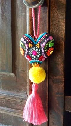 a door handle decorated with colorful decorations and tassels