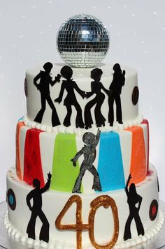 a birthday cake with the number forty on it and silhouettes of people dancing in front of a disco ball