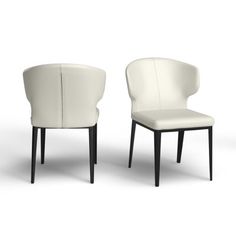 two white chairs sitting next to each other