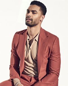 a man in a red suit sitting down