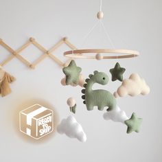 a baby crib mobile with toys hanging from it