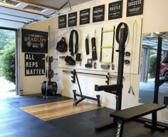 a home gym with equipment hanging on the wall