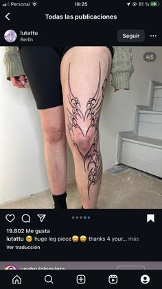 a woman's leg with tattoos on it