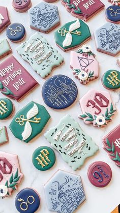 decorated cookies are displayed on a table for someone's 60th birthday party or special occasion