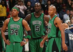 three basketball players standing next to each other