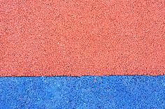 an orange and blue wall is shown in close up with no image to describe, it's the same color