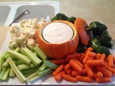 carrots, celery, cauliflower and other vegetables on a plate