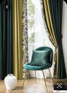 a green chair sitting in front of a window next to a white vase and curtain