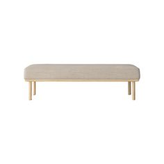 a beige bench sitting on top of a white floor