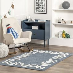 a child's room with a rocking chair and rug