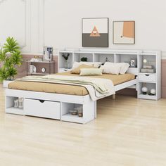 a white bed sitting on top of a hard wood floor next to a wall mounted shelf