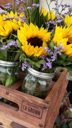 mason jars filled with yellow sunflowers and lavender