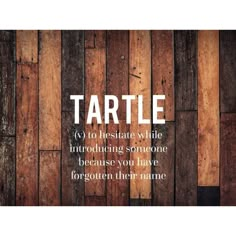 a wooden wall with the words turtle written in white on it's bottom corner