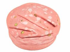 a pink doughnut with white hearts and sprinkles on it's wrapper