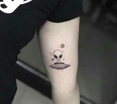 a person with a skull on their arm