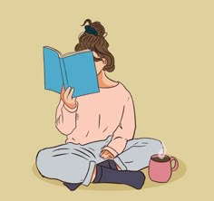 a woman sitting on the floor reading a book and holding a coffee cup in her hand