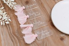 the table is set up with place settings for guests to sit down and sign their names